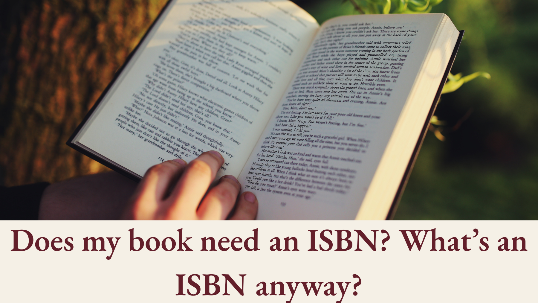 An open book being read outdoors, with the headline “Does my book need an ISBN? What’s an ISBN anyway?”